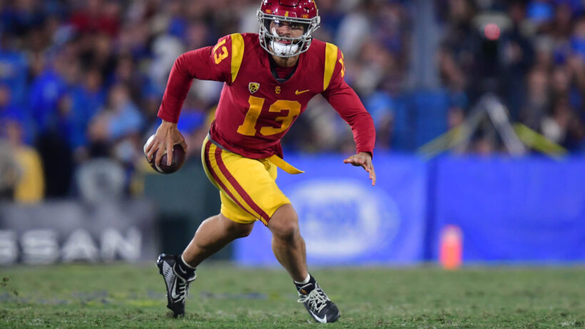 USC Trojans quarterback Caleb Williams runs the ball