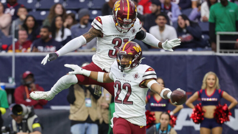 Washington Commanders defenders celebrate