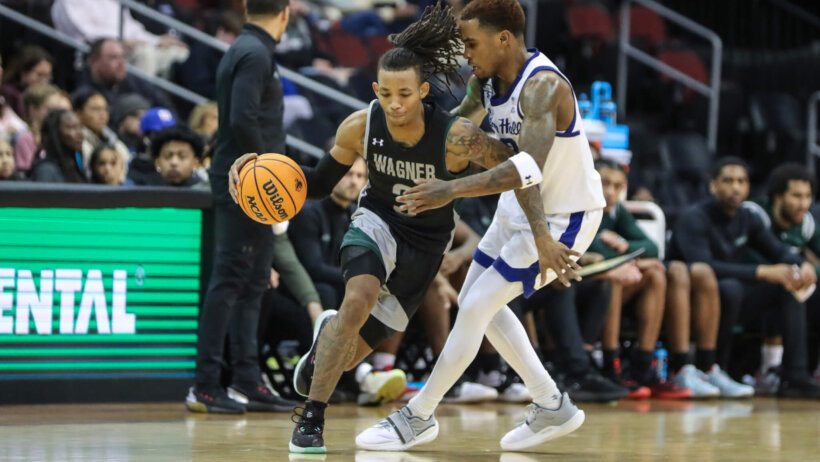 Wagner Seahawks guard DeLonnie Hunt dribbles around a defender