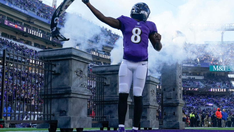 Lamar Jackson waving towel Baltimore Ravens