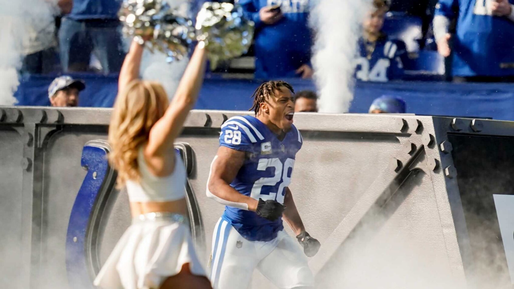 Jonathan Taylor runs onto the field