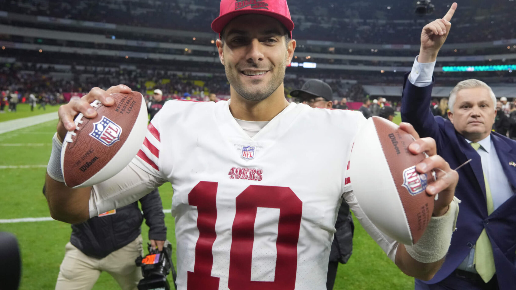 Jimmy Garoppolo holding footballs