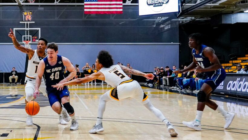UC-Davis guard Elijah Pepper drives to the hoop