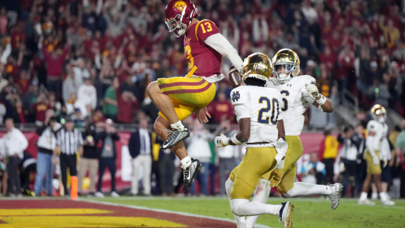 USC quarterback Caleb Williams celebrates after rushing for a touchdown against the Notre Dame Fighting Irish
