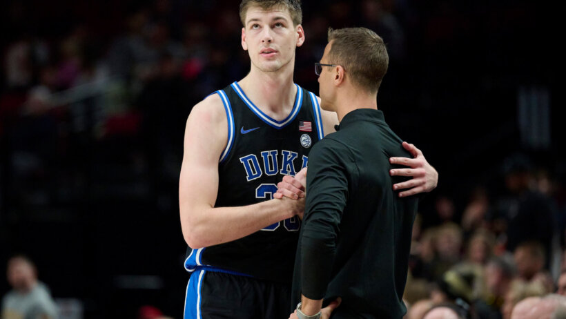 Duke Blue Devils center Kyle Filipowski talks to coach Jon Scheyer