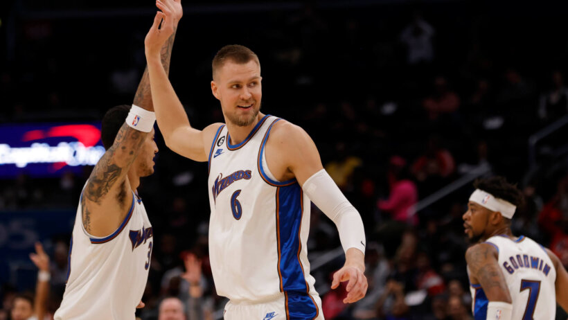Kristaps Porzingis and Kyle Kuzma high-five