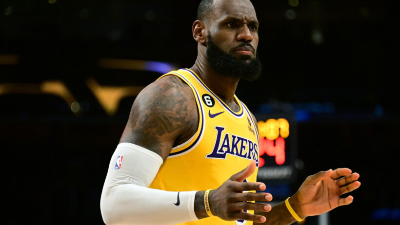 LeBron James hands out, waiting for call