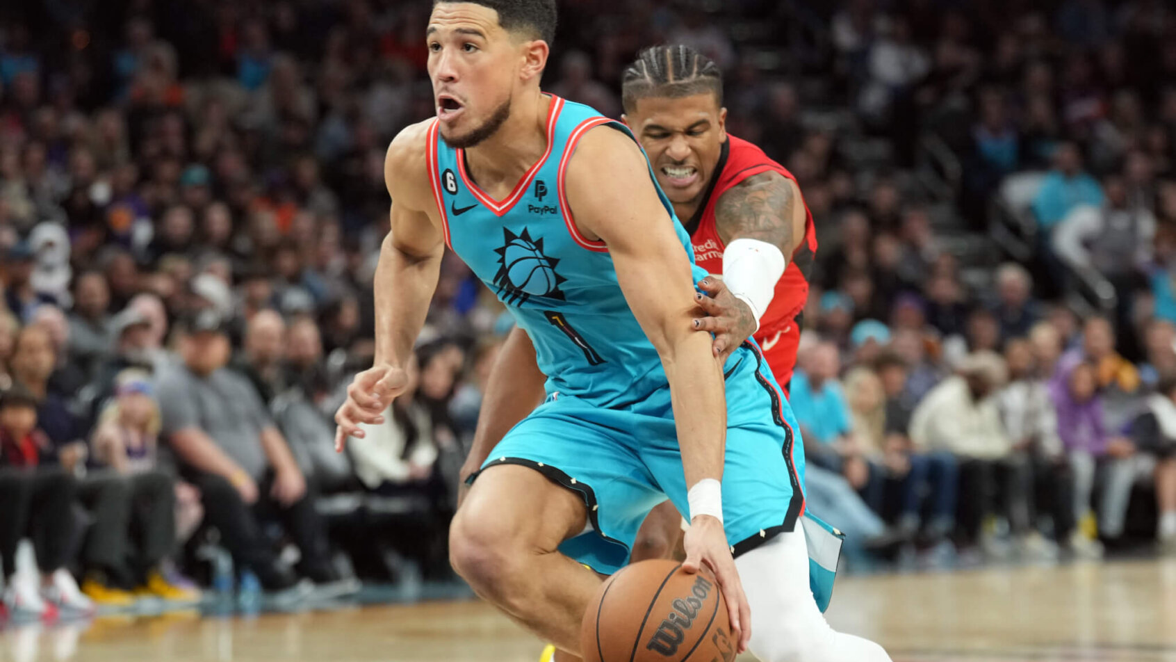 Devin Booker drives to the hoop