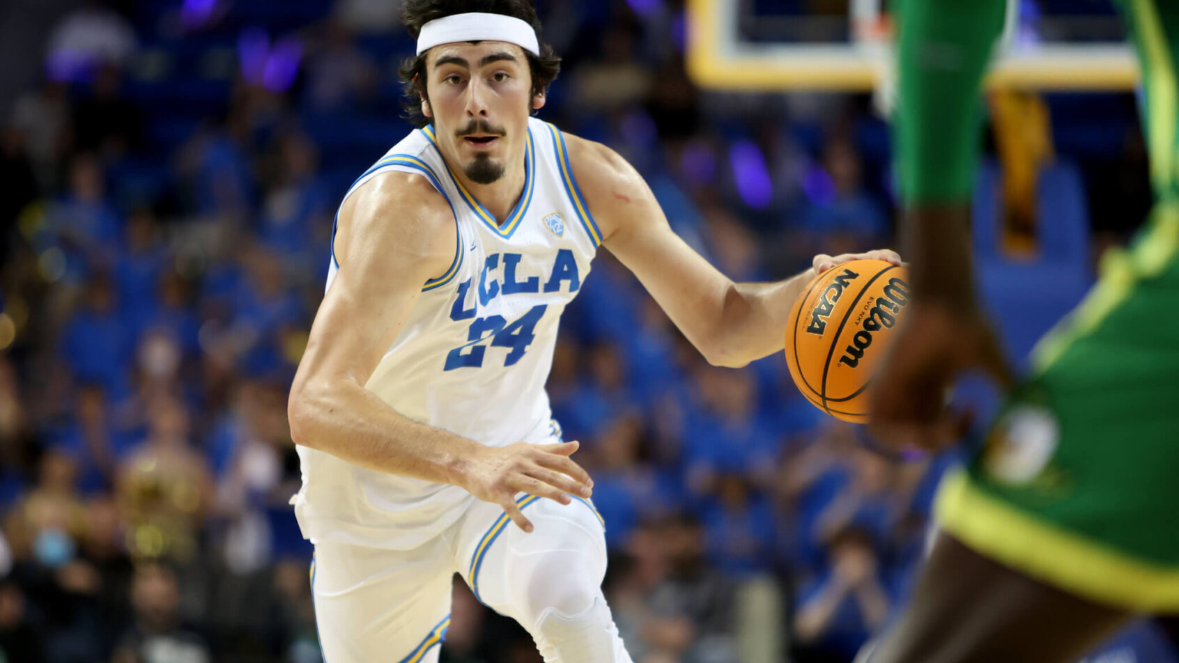 UCLA Bruins guard Jaime Jaquez dribbling up the court