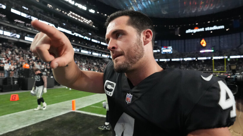 Derek Carr salutes a fan