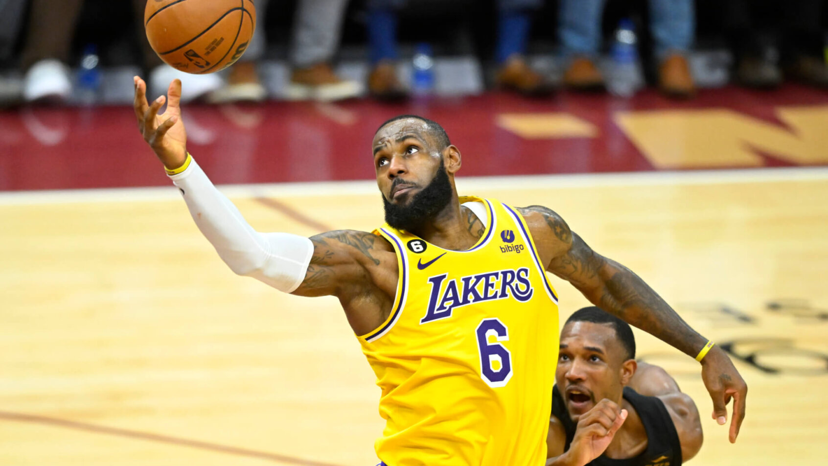 LeBron James reaches for a ball inside