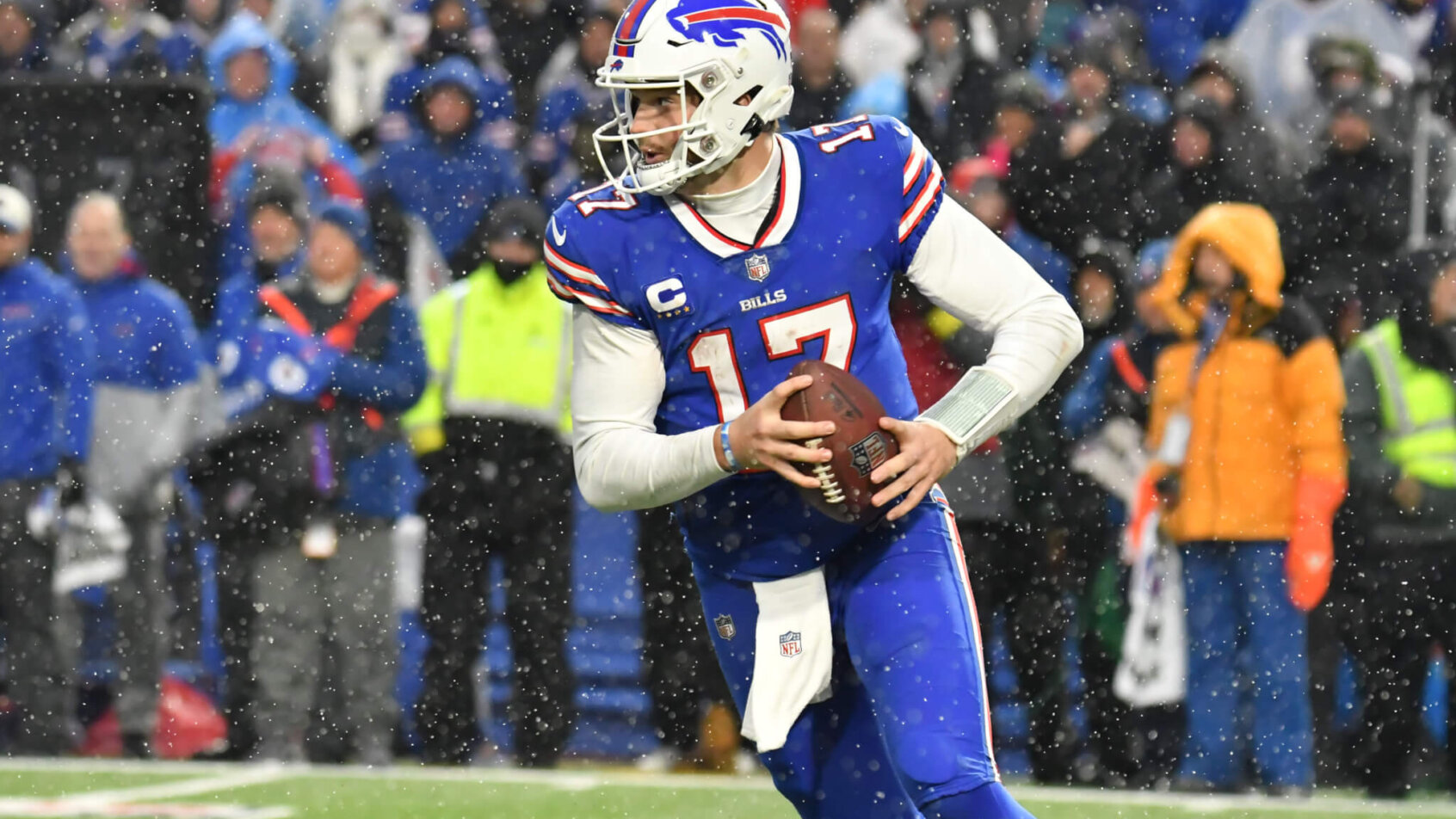 Bills quarterback Josh Allen rolls out of the pocket