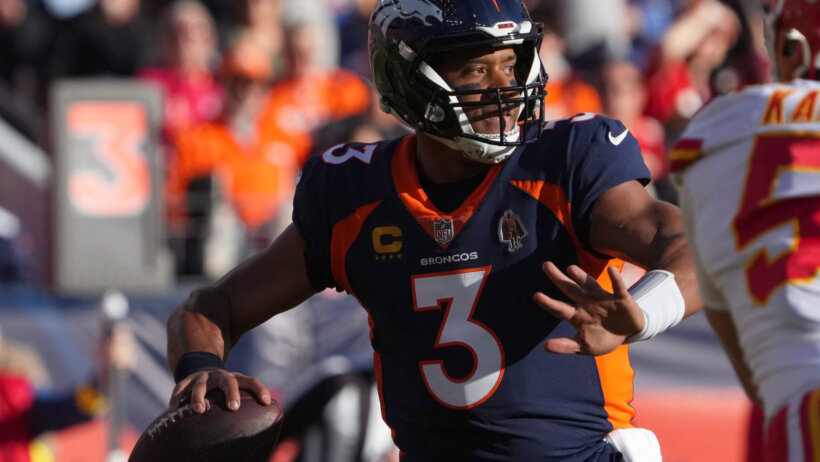 Broncos quarterback Russell Wilson prepares to pass the ball