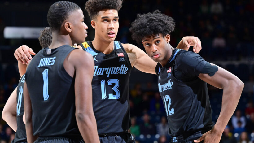 Marquette Golden Eagles players huddling before a game