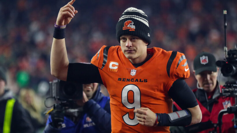 Joe Burrow salutes the crowd after beating the Chiefs