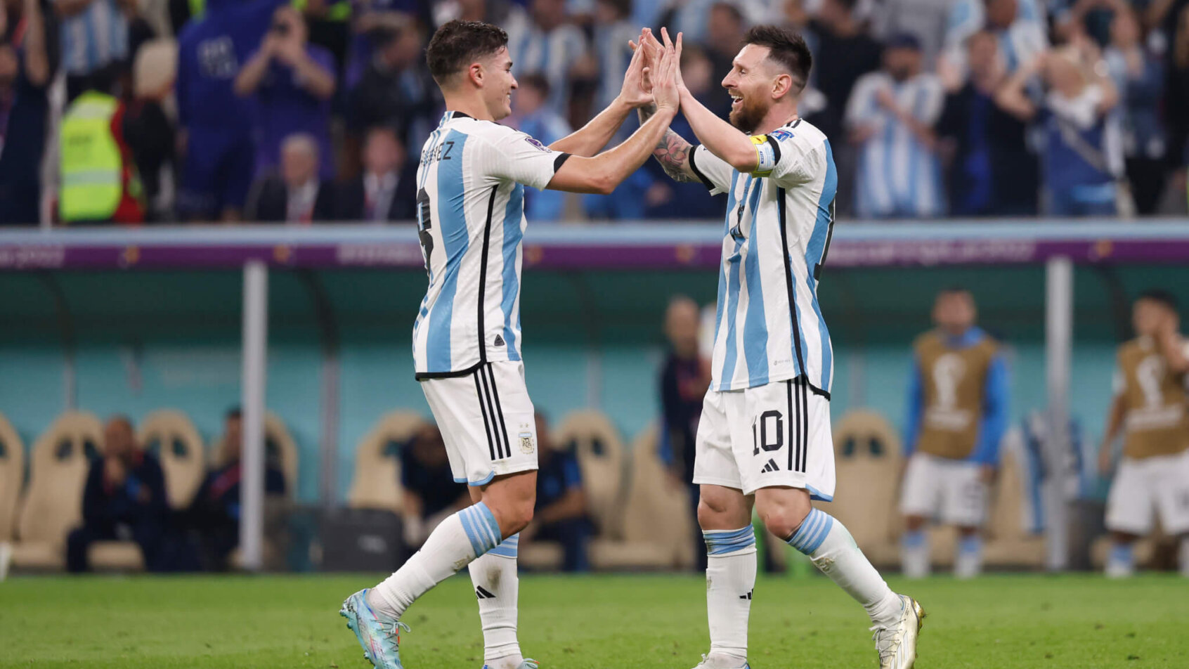 Argentina's Lionel Messi celebrates with a teammate.