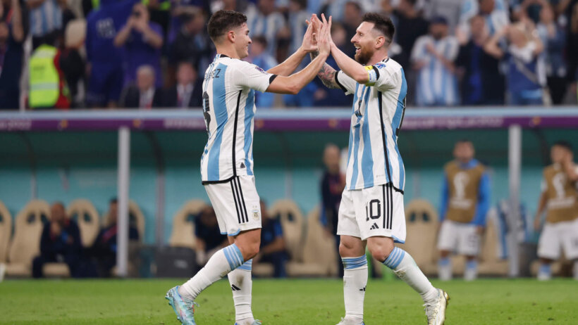 Argentina's Lionel Messi celebrates with a teammate.