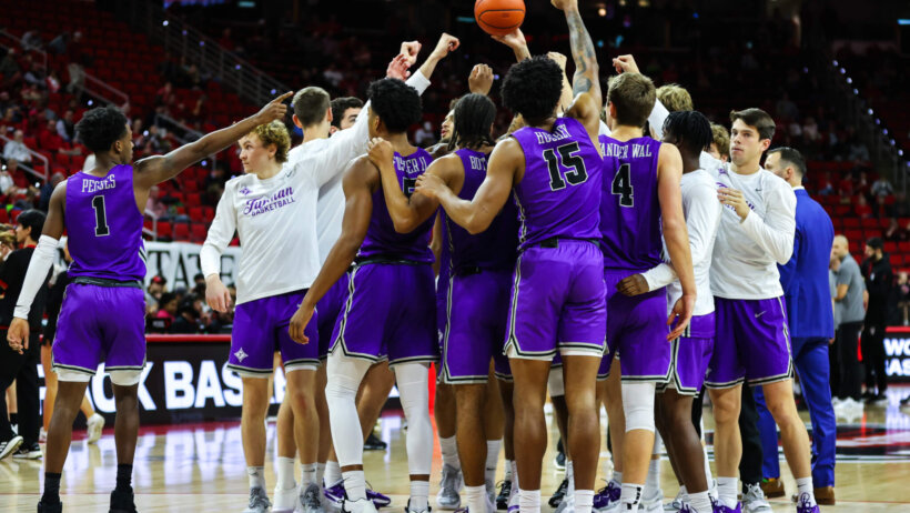 Furman Paladins huddle prior to facing NC State