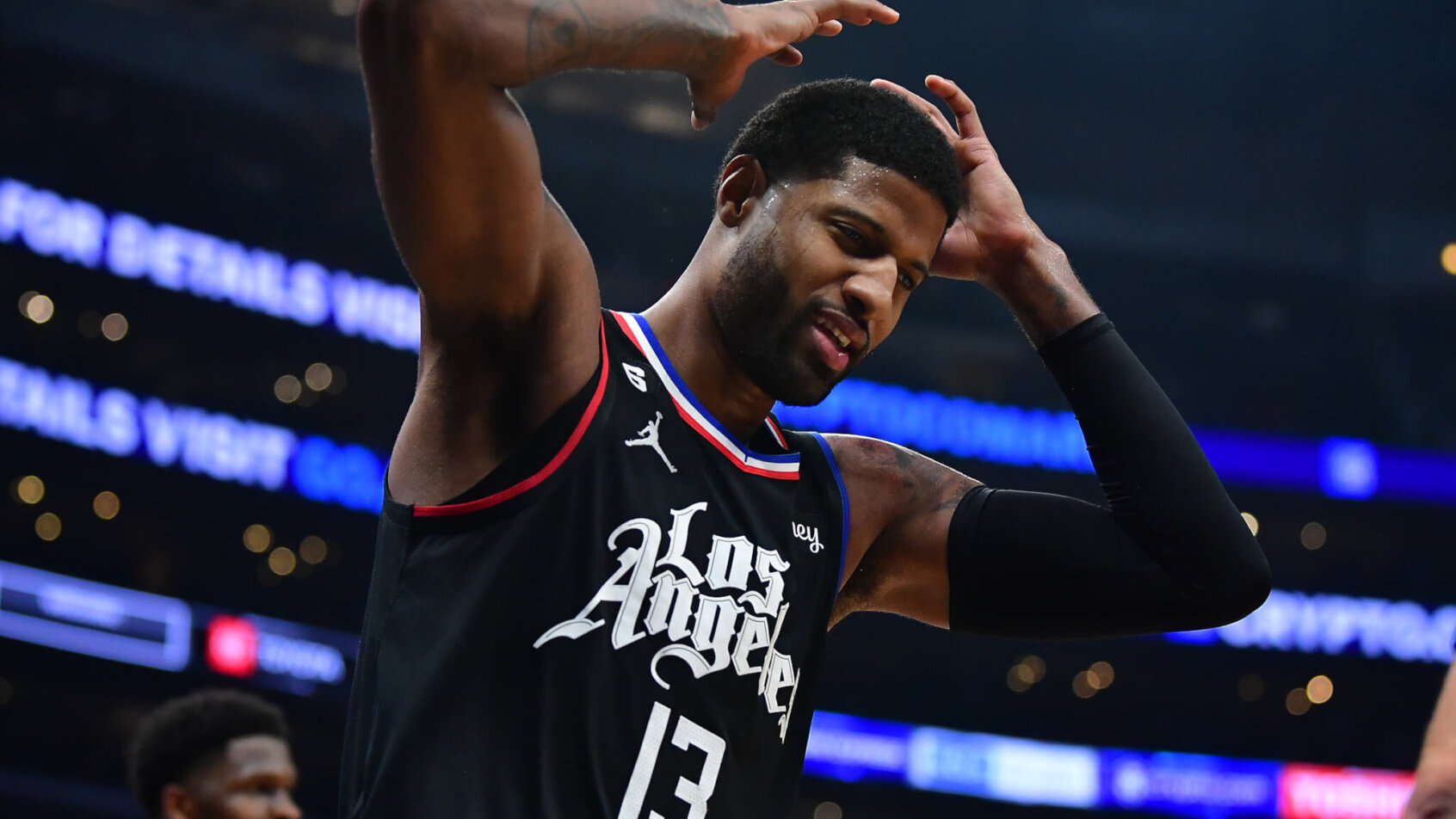 Paul George putting hands on head