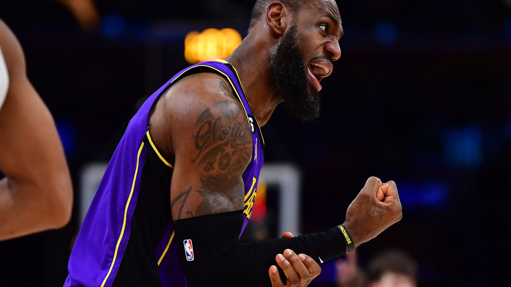 LeBron James grabbing forearm while talking to referee