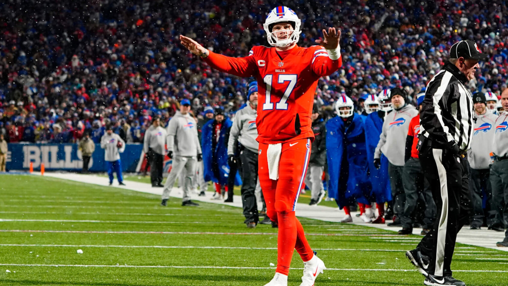 Josh Allen settling down crowd, waving arms
