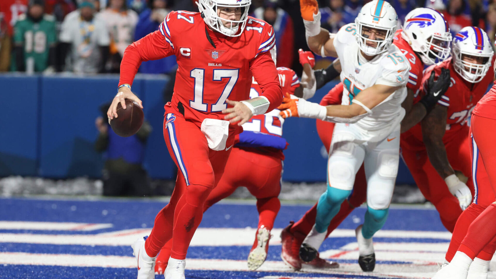 Josh Allen escapes the pressure of the Dolphins defense. Dolphins vs Bills Same-Game Parlay