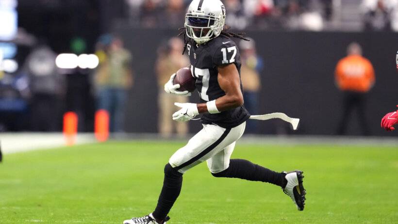 Las Vegas Raiders wide receiver Davante Adams gains yardage