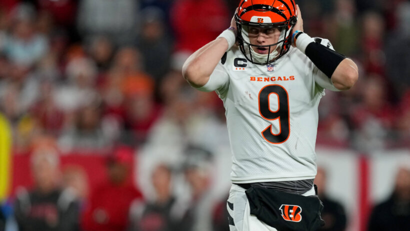 Joe Burrow hands over helmet ear holes