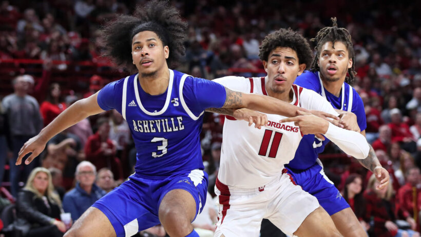 UNC Asheville Bulldogs guard Tajion Jones boxes out an opponent