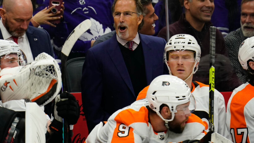 Philadelphia Flyers head coach John Tortorella talks to his team