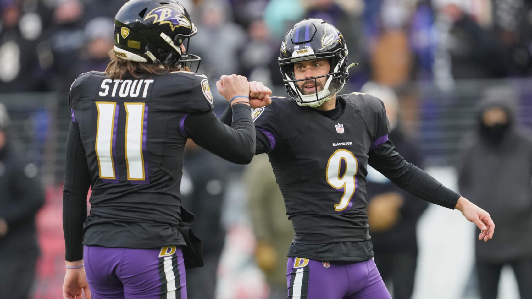 Justin Tucker fist-bumping Jordan Stout