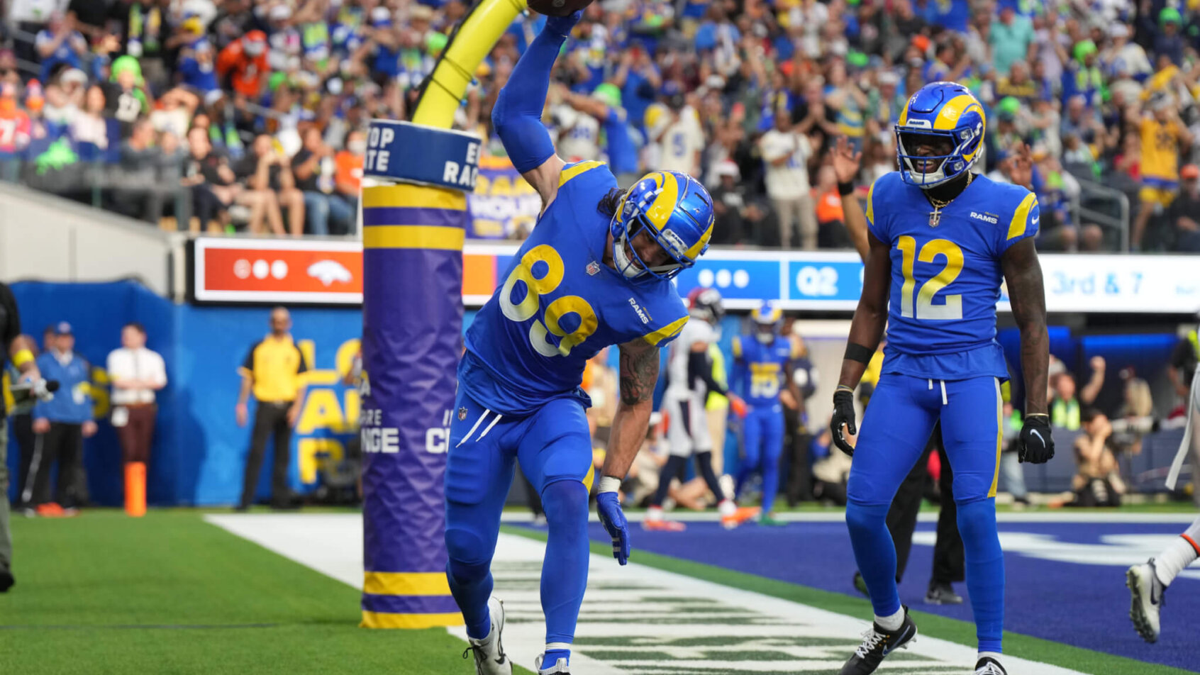 Los Angeles Rams tight end Tyler Higbee celebrates with wide receiver Van Jefferson