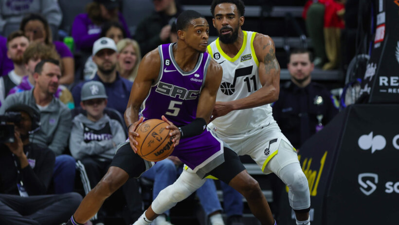 De'Aaron Fox defended in the post by Mike Conley Jr
