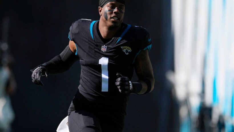 Jacksonville Jaguars RB Travis Etienne runs to the field