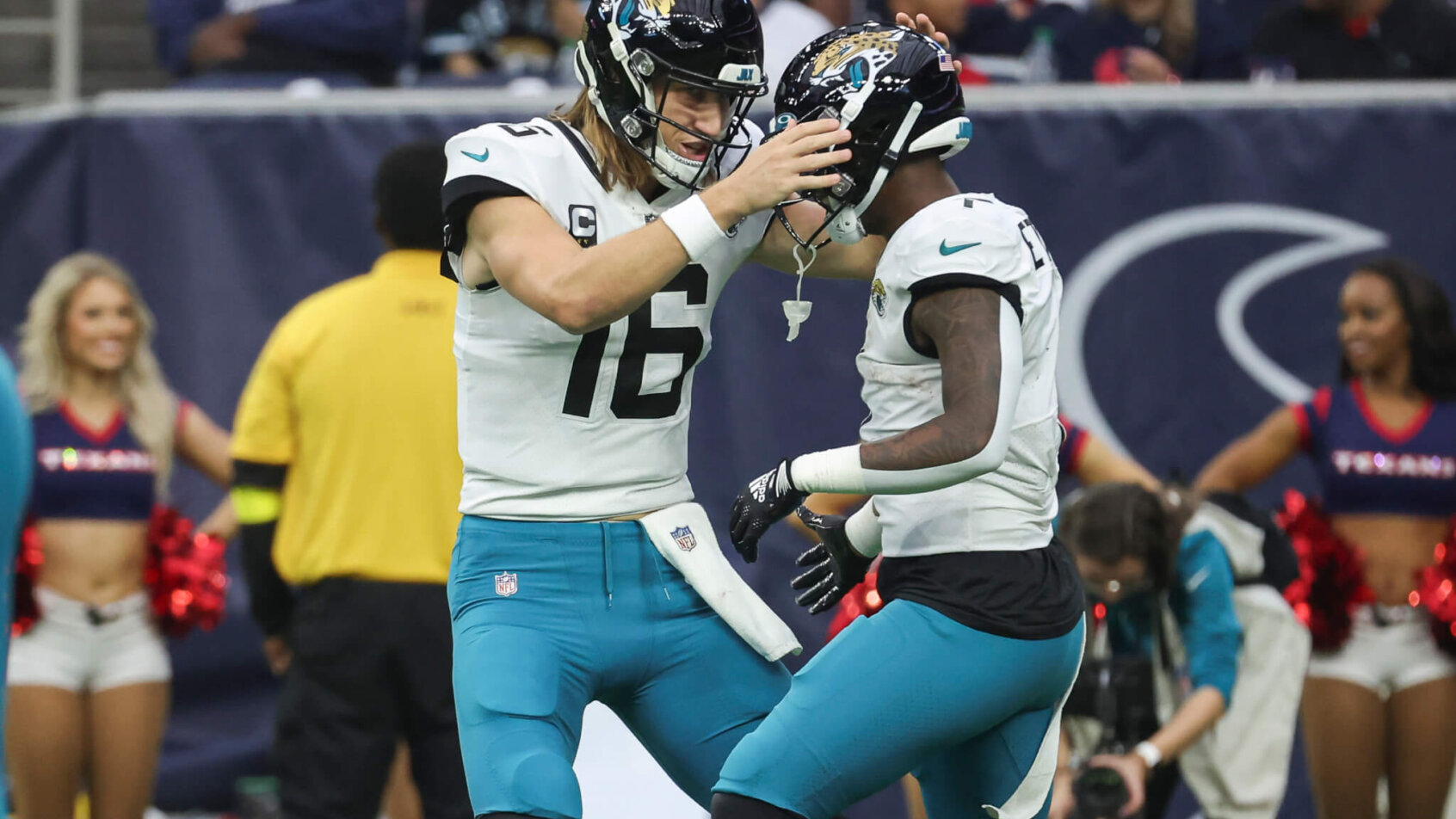 Trevor Lawrence celebrates with Travis Etienne Jr
