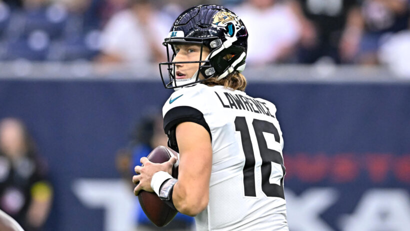 Jacksonville Jaguars quarterback Trevor Lawrence throws the ball