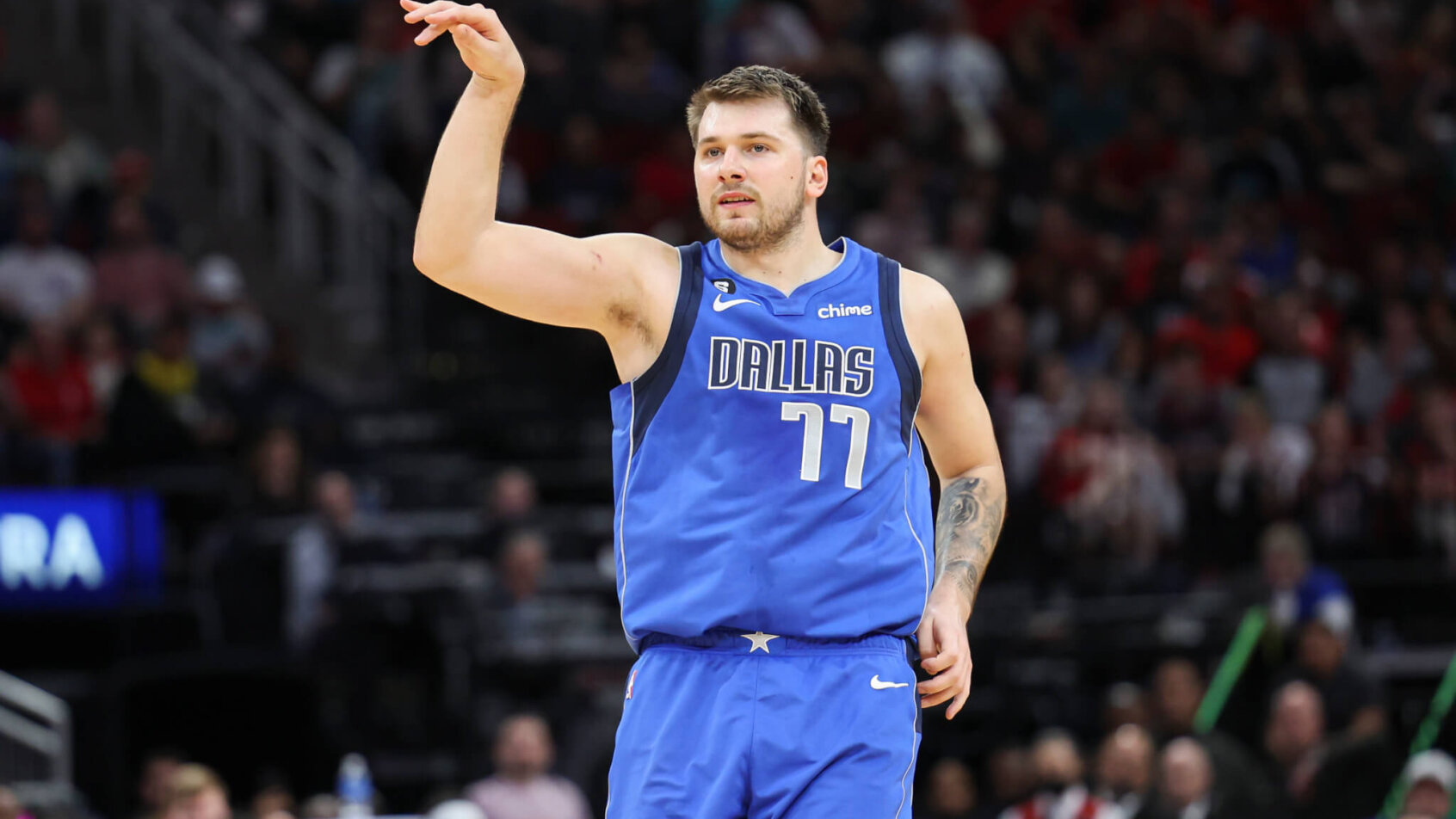 Luka Doncic strikes a pose after making a shot