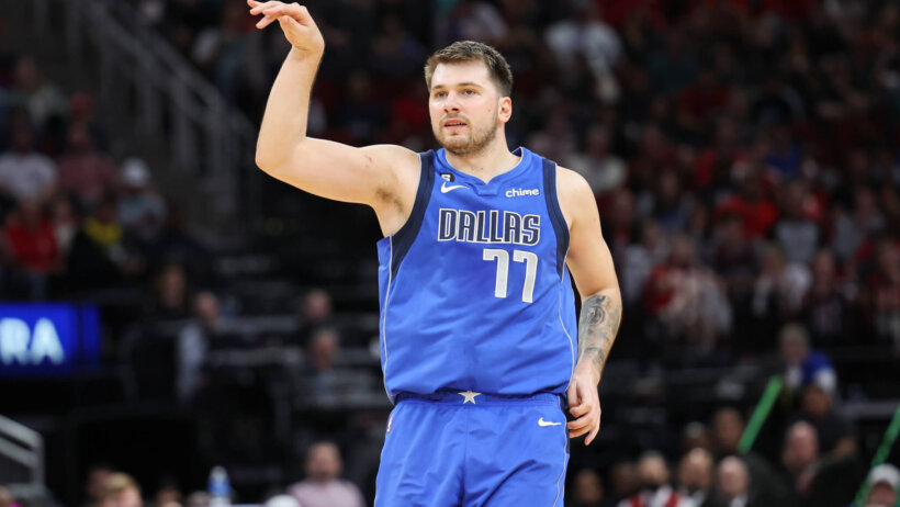 Luka Doncic strikes a pose after making a shot