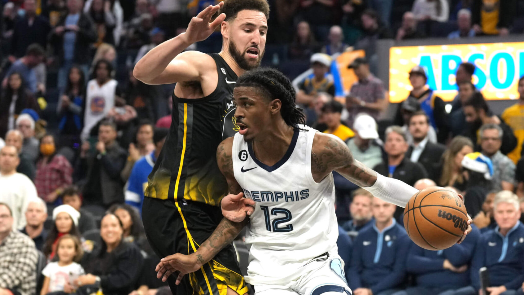Ja Morant dribbling against Klay Thompson