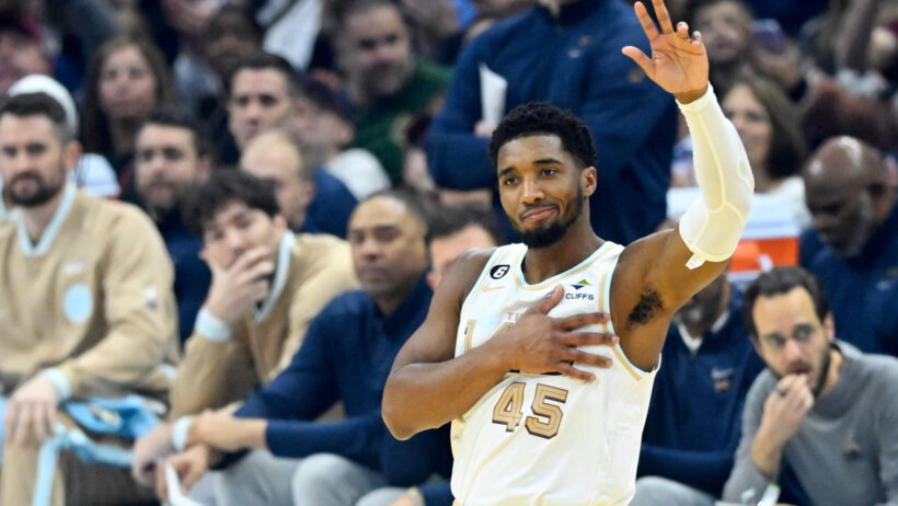Donovan Mitchell waving to fans