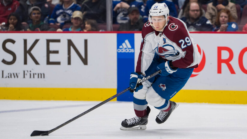 Colorado Avalanche forward Nathan MacKinnon skates with the puck