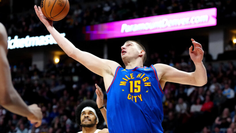 Nikola Jokic battle with the Cavaliers for a loose ball