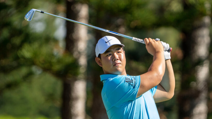 Tom Kim hits his tee shot