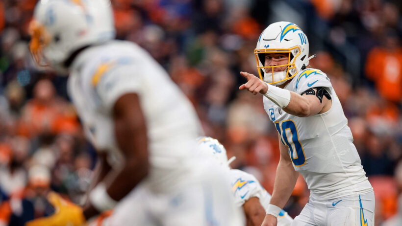 Los Angeles Chargers quarterback Justin Herbert gestures at the line of scrimmage