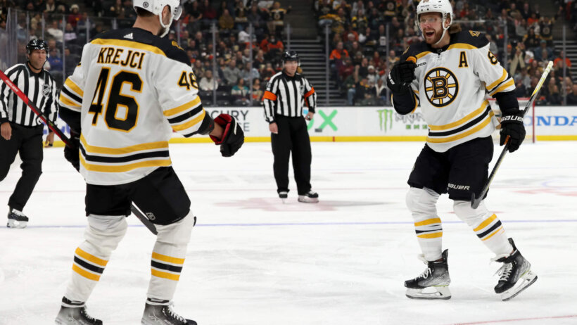 Boston Bruins David Pastrnak and David Krejci celebrate goal