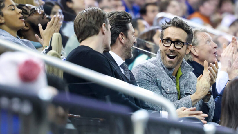 Ryan Reynolds cheers during NHL game