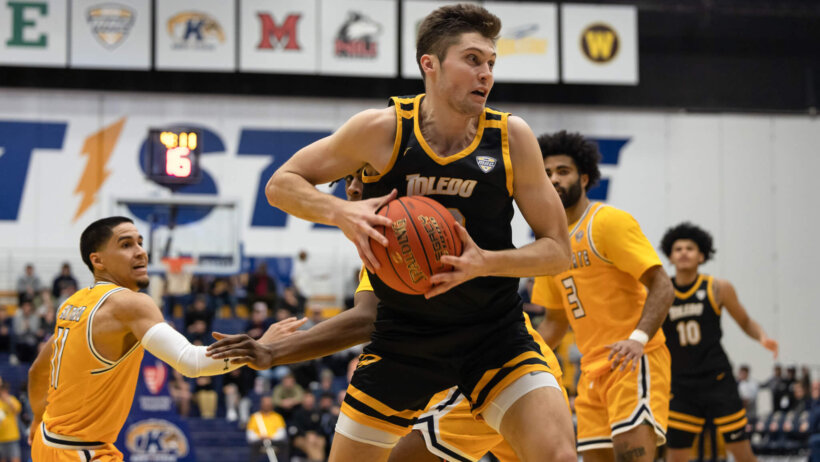 Toledo forward JT Shumate holding basketball