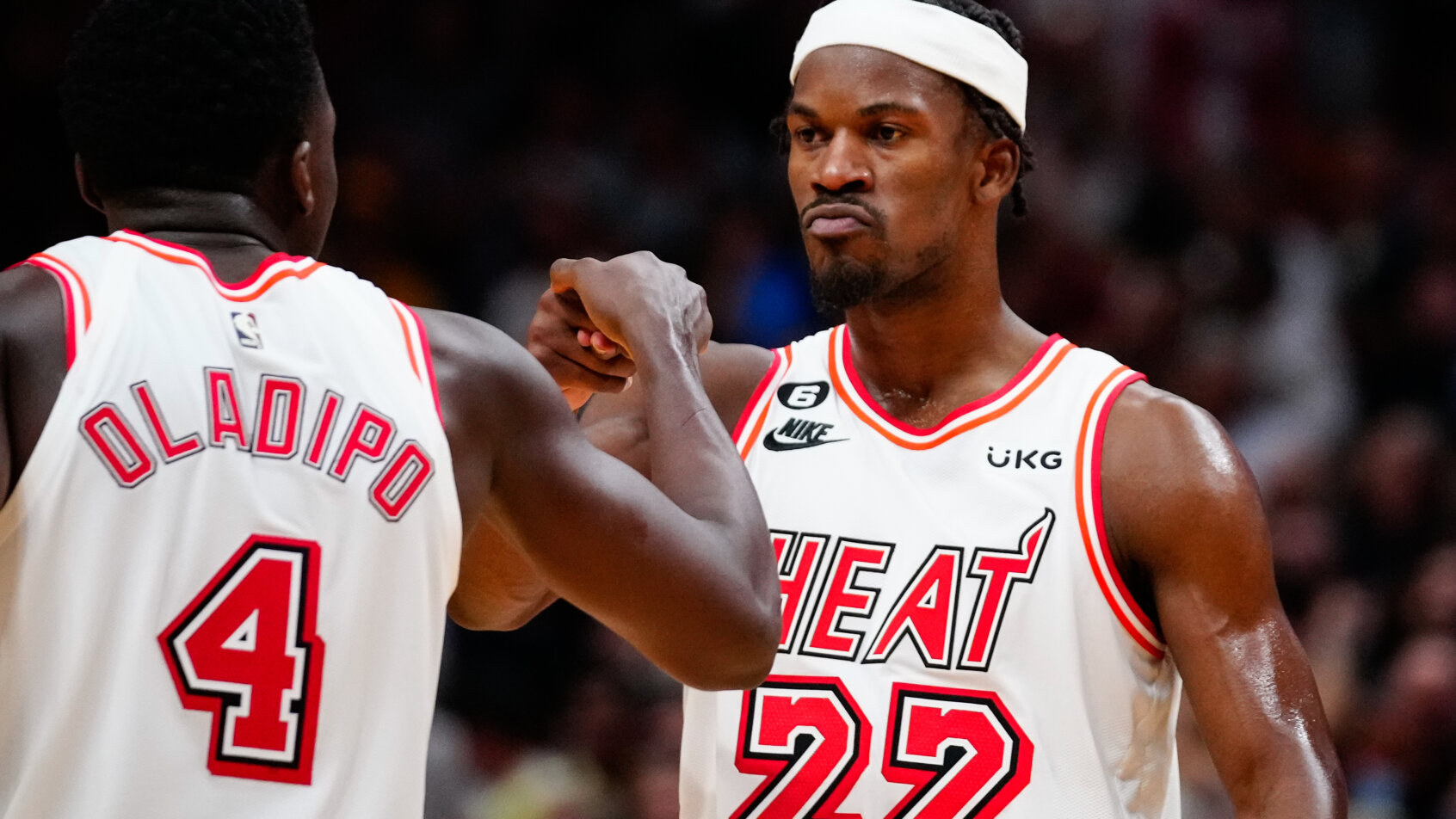 Jimmy Butler fist bumps Victor Oladipo