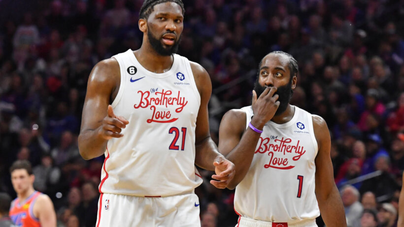 Joel Embiid on court talking to James Harden