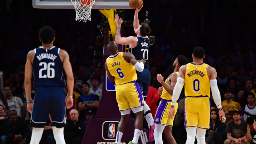 Luka Doncic scoring over LeBron James